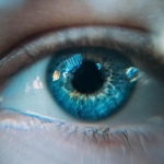 Slightly blurred close-up photo of a blue eye